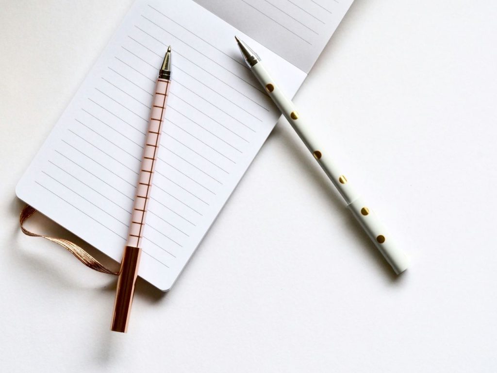 Clean white page with pens ready for a fresh set of writing prompts.