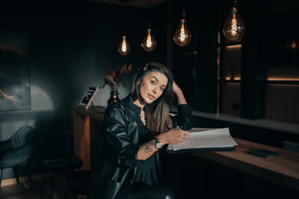 Writer reviewing her notes, checking off the elements of plot.