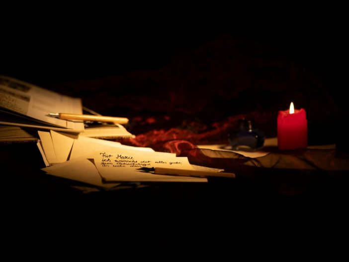 Pile of mail and soft candlelight, evoking the mood of literary fiction.