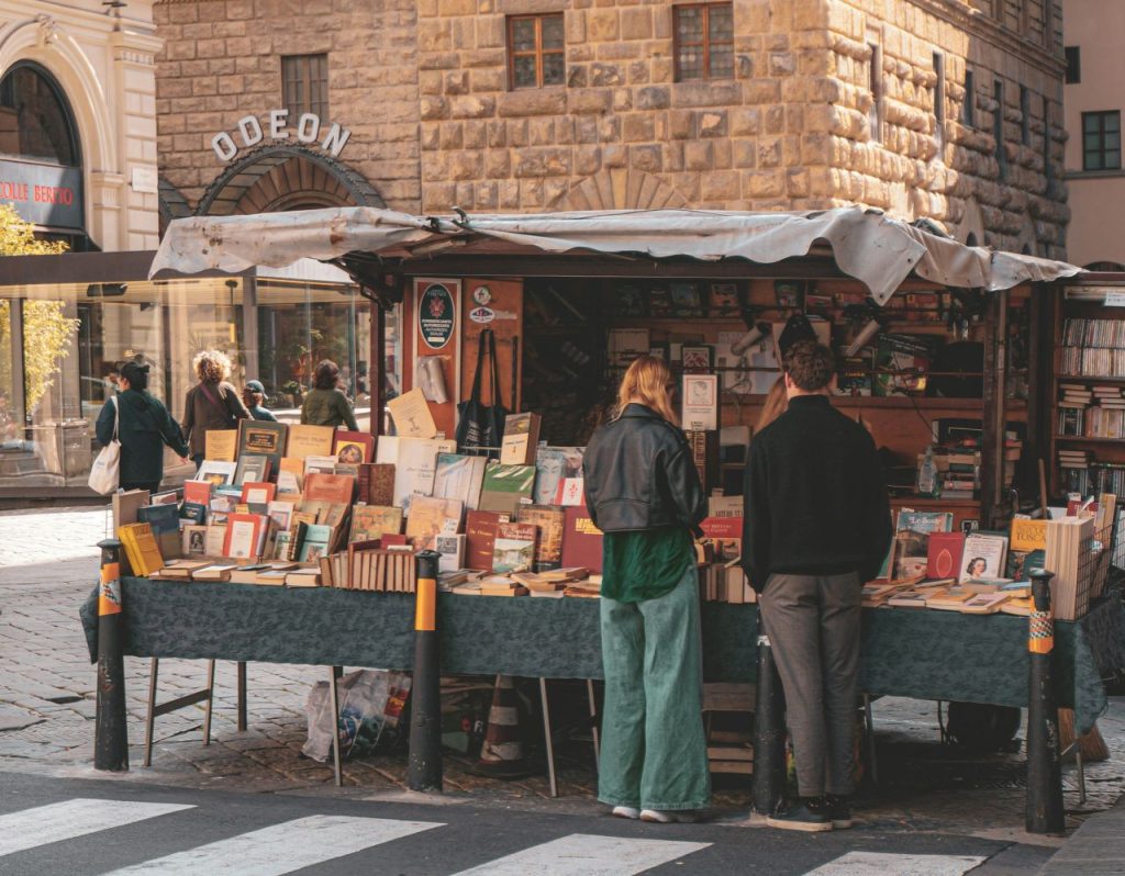 Vibrant outdoor book fair, demonstrating creative ways for how to market your novel.