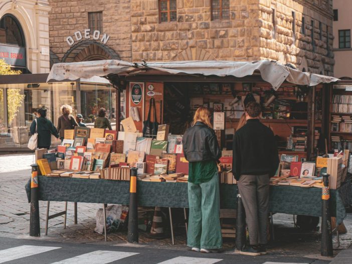 Vibrant outdoor book fair, demonstrating creative ways for how to market your novel.